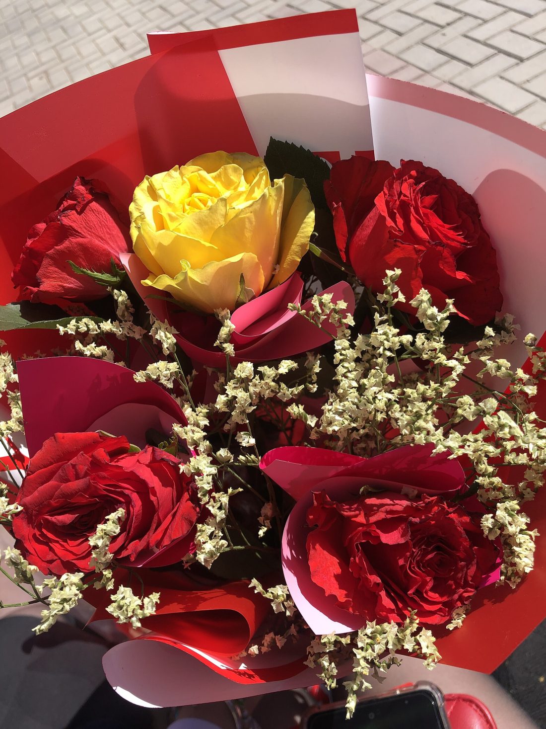 A lush bouquet of red and yellow roses